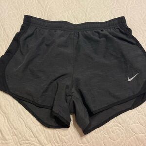 Dark grey nike shorts; size youth medium
